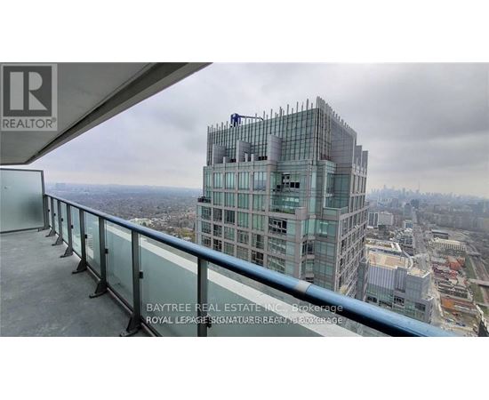 A view from a high-rise building looking down at a cityscape.