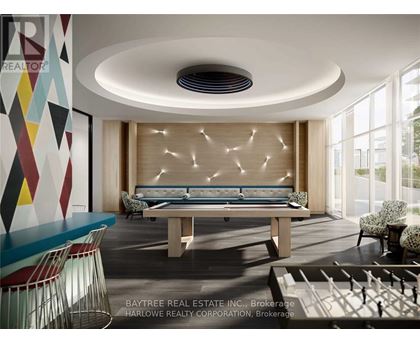 A modern living room with a pool table and a large window.