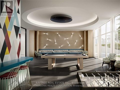 A modern living room with a pool table and a large window.