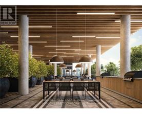 A modern dining area with a long table surrounded by chairs and a ceiling with wooden slats.