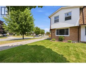 A house with a lawn in front of it.