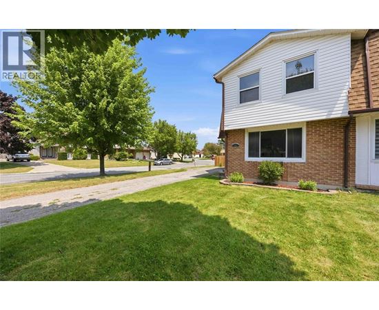 A house with a lawn in front of it.