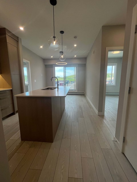 A modern kitchen with a large island in the middle.