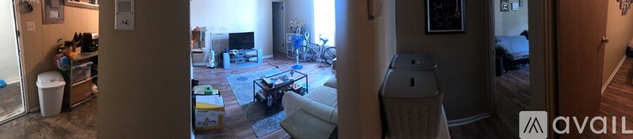 A living room with a couch and a television.
