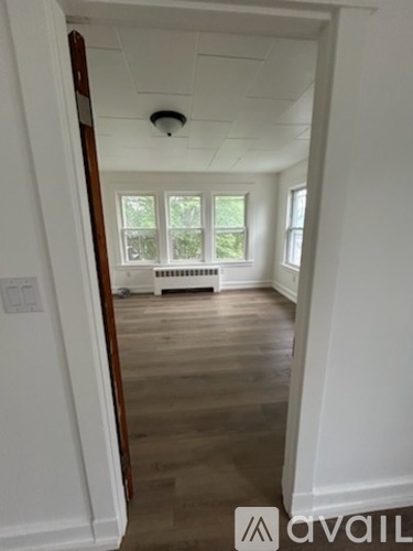 A room with a window and a radiator.