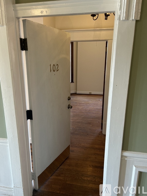 A hallway with a door numbered 102 is shown.