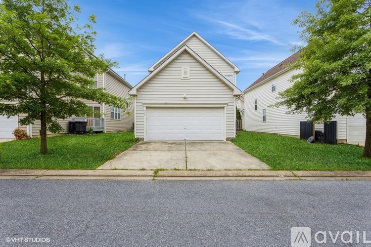A house with a garage is available for sale.