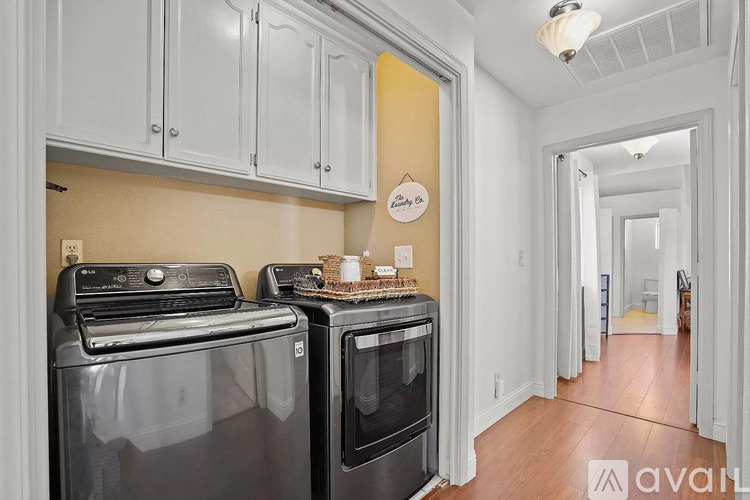A kitchen with a black oven and stove top.