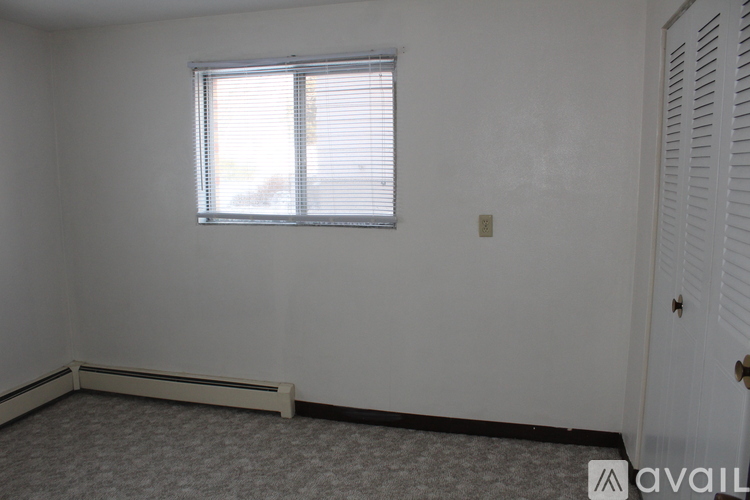 A room with a window and a door.