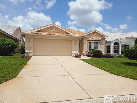 A house with a driveway in front of it.