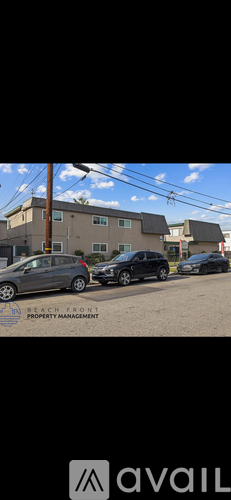A car is parked in front of a house with the text "BEACH FRONT PROPERTY MANAGEMENT" on the image.