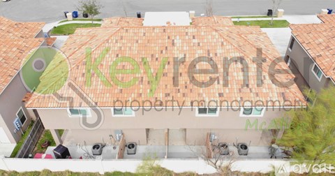 An aerial view of a building with a sign that reads "keyvente property management".