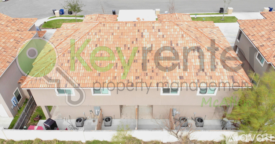 An aerial view of a building with a sign that reads "keyvente property management".