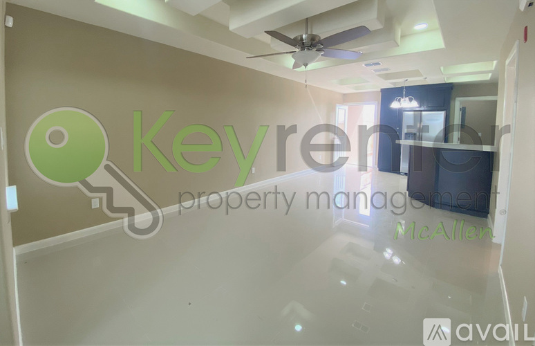 A room with a logo that says "Key Ren Property Management" on the wall.
