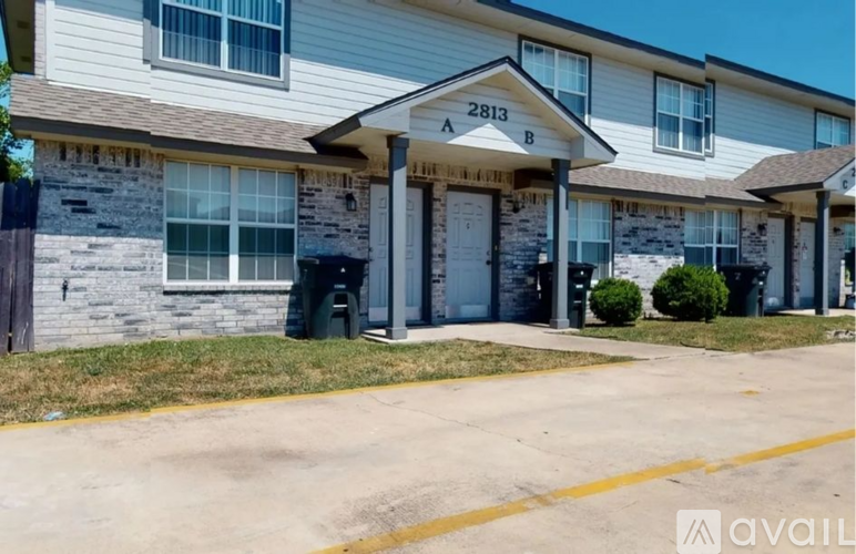 The image shows the front of a building with the number 2813 on it.