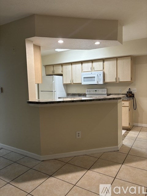 A kitchen with a counter and cabinets.