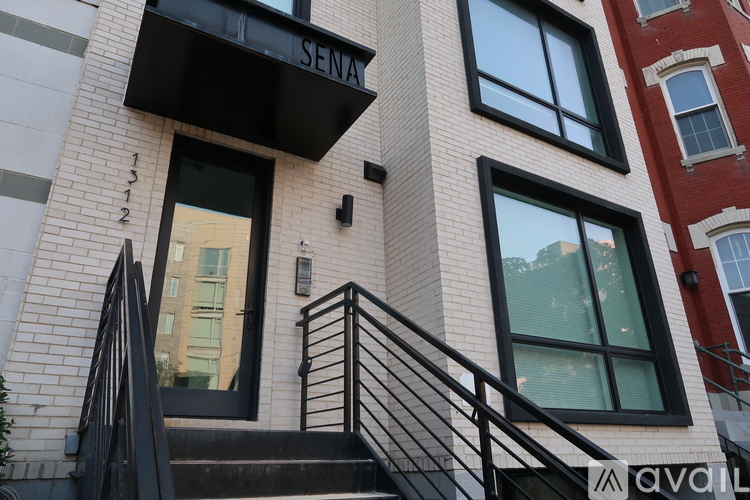 A building with the word SENA on the awning.