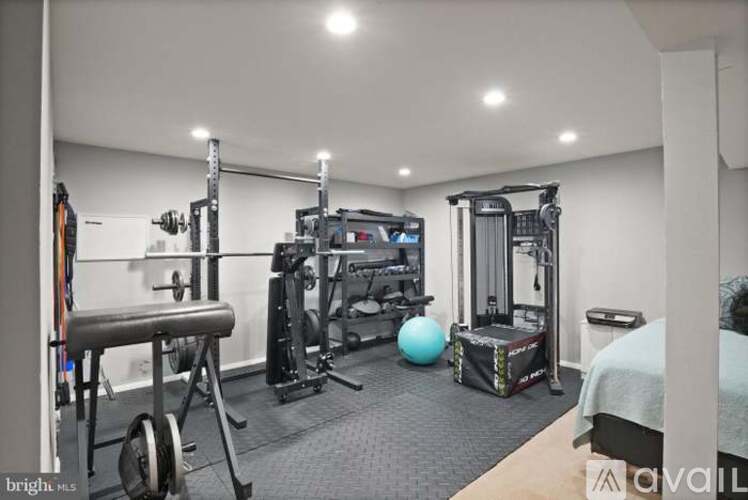 A well-equipped home gym with a variety of exercise equipment.