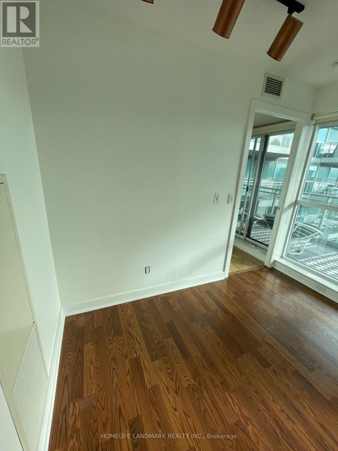 A room with wooden floors and white walls.