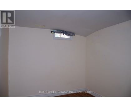 A room with a brokerage logo on the wall.