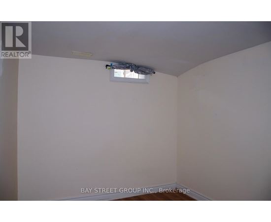 A room with a brokerage logo on the wall.