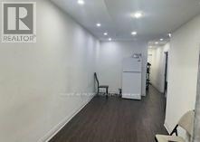 A room with a chair and a cabinet in it.