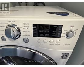 A front load washing machine with the door open.