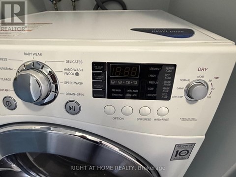 A front load washing machine with the door open.
