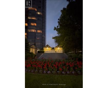 A building with a garden in front of it.