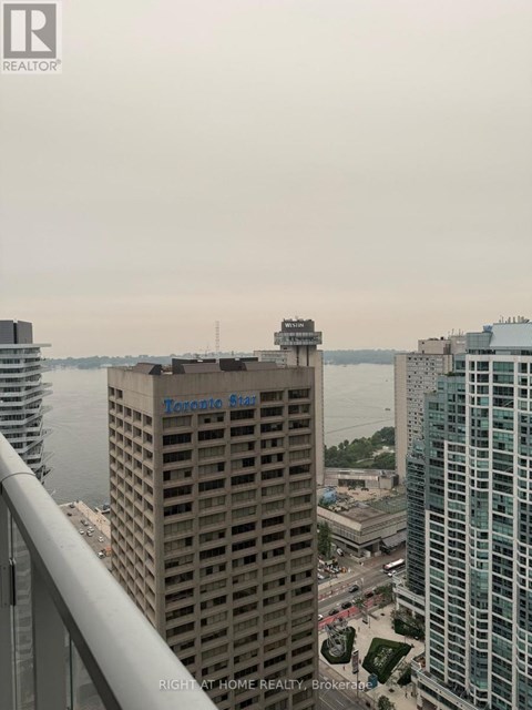 A view of a cityscape with the Toronto Star building prominently displayed.