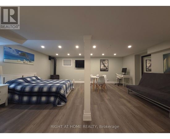 A bedroom with two beds and a couch.
