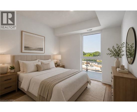A bedroom with a large bed and a view of the outside through a sliding glass door.