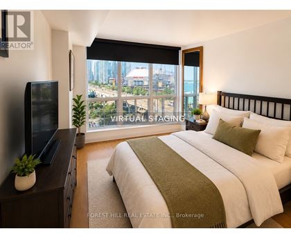 A bedroom with a large bed and a flat screen TV.