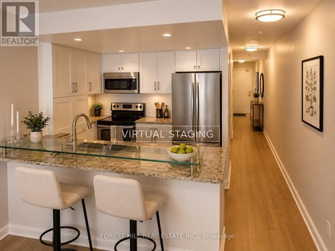 A kitchen with a glass counter top and white bar stools.