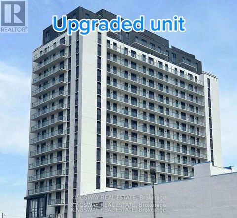 A tall building with the words "Upgraded unit" written across the top.