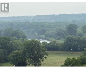 A real estate brokerage logo is superimposed on a misty landscape image.