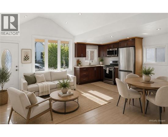 A modern kitchen with a dining table set for four.