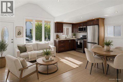 A modern kitchen with a dining table set for four.