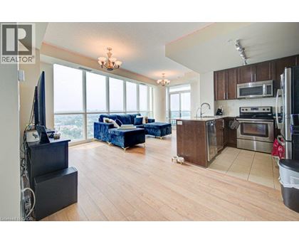 A living room with a couch and a television.