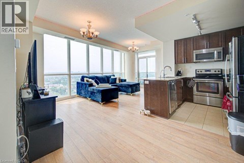 A living room with a couch and a television.
