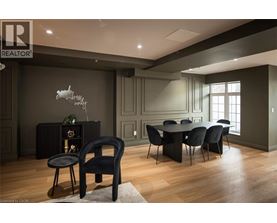 A modern dining room with a black chair and table.