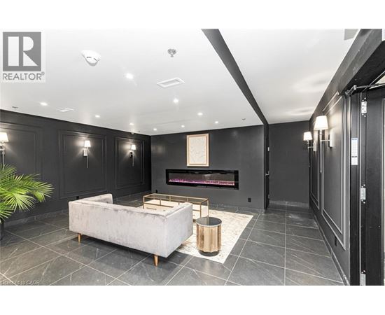 A modern living room with a fireplace and a white sofa.