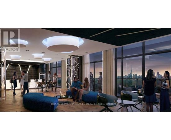 A group of people are gathered in a modern living room.