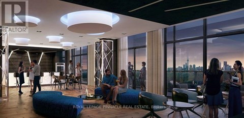 A group of people are gathered in a modern living room.