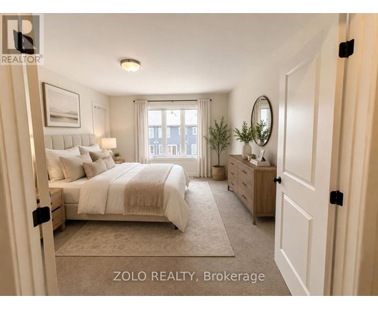 A well-lit bedroom with a large bed, a dresser, and a mirror.