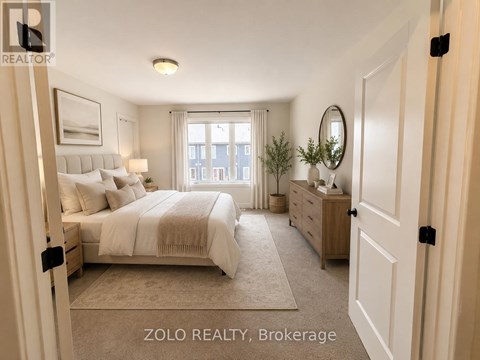 A well-lit bedroom with a large bed, a dresser, and a mirror.