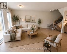 A living room with a white couch and a coffee table.