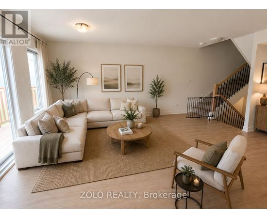 A living room with a white couch and a coffee table.