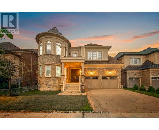 A large house with a stone facade and a large front yard.