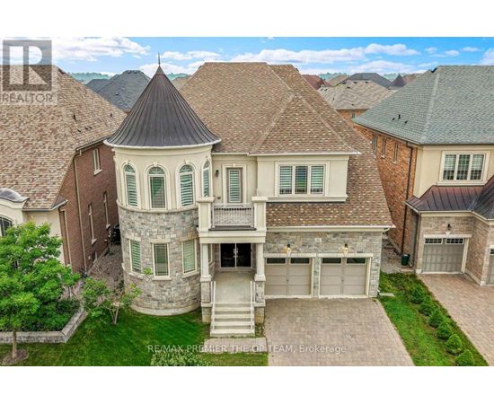A large house with a tower-like structure on the roof.